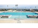 Rooftop pool with lounge chairs and city views at 301 1St S St # 804, St Petersburg, FL 33701