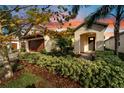 Beautiful home exterior at sunset, showcasing landscaping at 16820 Anchor Root St, Wimauma, FL 33598