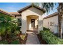Welcoming front entry with covered porch and walkway at 16820 Anchor Root St, Wimauma, FL 33598