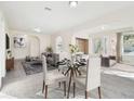 Bright and airy living room with a dining area and neutral decor at 5308 Clewis Ave, Tampa, FL 33610