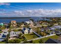 Aerial view of a charming coastal community with stunning waterfront views and lush landscaping perfect for relaxing at 5946 Bayou Grande Ne Blvd, St Petersburg, FL 33703