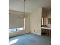 Simple dining room with light-blue carpet and chandelier at 702 Dorado Ct, Brandon, FL 33511