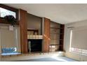 Spacious living room with built-in shelving and a fireplace at 702 Dorado Ct, Brandon, FL 33511