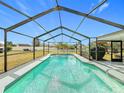 Relaxing screened-in pool with backyard view at 1720 Flamingo Ln, Sun City Center, FL 33573
