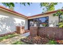 Charming front entrance featuring brick accents, creating a welcoming atmosphere at 3466 Maclaren Dr, Palm Harbor, FL 34684
