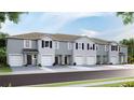 New townhouses with two-car garages and neutral colors at 487 Mangrove Shade Cir, Apollo Beach, FL 33572