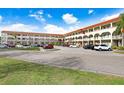 Two-story condo building with parking and landscaped grounds at 2434 Australia E Way # 42, Clearwater, FL 33763
