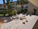 Small patio area with table and chairs at 12300 Vonn Rd # 6103, Largo, FL 33774