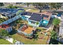 House with solar panels, deck, shed, and backyard at 2209 Gladys St, Largo, FL 33774