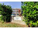 Brick building sign identifying Saratoga 2460 at 2460 Persian Dr # 26, Clearwater, FL 33763