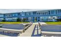 Private dock with seating, offering waterfront access at 250 126Th Ave # 206, Treasure Island, FL 33706