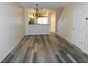 Open dining area with wood-look vinyl flooring at 262 Countryside Key Blvd, Oldsmar, FL 34677
