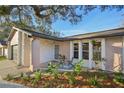 Updated ranch home with inviting front porch and landscaping at 3911 King Dr, Brandon, FL 33511