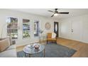Bright and airy living room with hardwood floors and large windows at 3911 King Dr, Brandon, FL 33511
