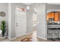 Bright and airy entryway with tile flooring, leading to a kitchen at 5128 6Th N Way, St Petersburg, FL 33703