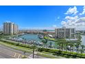Aerial view of waterfront community with marina and lush landscaping at 1660 Gulf Blvd # 706, Clearwater Beach, FL 33767