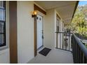 Condo entryway with private balcony and exterior view at 2400 Winding Creek Blvd # 21A-202, Clearwater, FL 33761