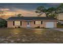 Charming single story home with front yard at sunset at 289 Killinger Ave, Spring Hill, FL 34606