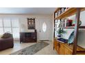 Entryway with white door, wood shelving, and decorative accents at 6888 121St N St, Seminole, FL 33772
