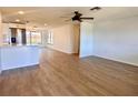 Spacious open-concept living area with wood-look floors, bright natural light, and modern finishes at 7521 Bougenville Dr, Port Richey, FL 34668