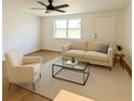 Bright, staged living room featuring neutral tones, stylish furnishings, and an inviting atmosphere at 7521 Bougenville Dr, Port Richey, FL 34668