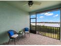 Relaxing screened patio with waterfront views, perfect for enjoying serene outdoor moments at 1003 Starboard Ct, Oldsmar, FL 34677