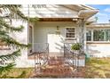 Front porch with terracotta tile flooring and ornate railings at 1023 W Ohio Ave, Tampa, FL 33603