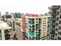 Stunning view of a modern, high-rise condominium complex in an urban setting with floor to ceiling glass and private balconies at 1120 E Kennedy Blvd # 1225, Tampa, FL 33602
