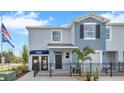 Two-story townhome with modern facade and fenced yard at 11851 Davis Dr, Largo, FL 33774