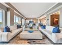 Bright and airy living room featuring modern furnishings, neutral color palette, and water views at 20001 Gulf Blvd # 501, Indian Shores, FL 33785