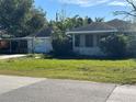 Ranch style home with carport and mature trees at 2508 50Th N Ave, St Petersburg, FL 33714