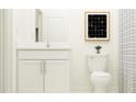 Small bathroom with white cabinets and a shower/tub combo at 35167 Gravelly Dr, Zephyrhills, FL 33541