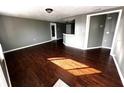 Spacious living area with dark wood laminate flooring at 5027 Farley Dr, Holiday, FL 34690