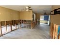 An open living area under renovation; exposed framing and flooring at 5641 1St Ne St, St Petersburg, FL 33703