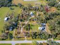 Aerial view of the property showcasing the extensive land and its private, wooded surroundings at 4501 Keene Rd, Plant City, FL 33565