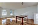 Spacious living area with hardwood floors and arched windows at 11309 Outrigger Ave, Spring Hill, FL 34608