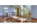 Bright living room featuring hardwood floors and lots of natural light at 11309 Outrigger Ave, Spring Hill, FL 34608