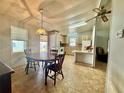 View of the dining room flowing into the kitchen area at 225 N Saint Thomas Cir, Apollo Beach, FL 33572