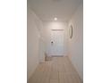Bright entryway with tile flooring, stairs, and a circular mirror at 22547 Storybook Cabin Way, Land O Lakes, FL 34637