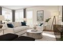 Sun-filled living room with plush seating, stylish decor, and access to a private balcony at 600 3Rd S Ave # 405, St Petersburg, FL 33701