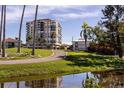 High-rise building near a golf course and pond at 6372 Palma Del Mar S Blvd # 705, St Petersburg, FL 33715