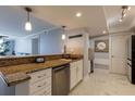 Modern kitchen with granite counters and stainless steel appliances at 6372 Palma Del Mar S Blvd # 705, St Petersburg, FL 33715