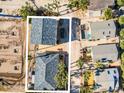 Aerial view of two houses with gray roofs and a parking area at 820 Gulf Blvd # S 1-3, Indian Rocks Beach, FL 33785