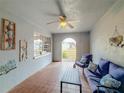 Front porch with seating area and access to yard at 2110 Clifton Dr, Valrico, FL 33594