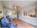 Inviting front porch with seating and tiled floor at 2110 Clifton Dr, Valrico, FL 33594