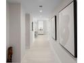 Bright hallway with modern art and tile floors at 301 1St S St # 803, St Petersburg, FL 33701