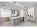 Modern kitchen with wood cabinets and quartz countertops at 301 1St S St # 803, St Petersburg, FL 33701