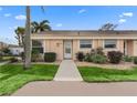 Condo with a landscaped yard and walkway at 6250 7Th W Ave # 6250, Bradenton, FL 34209
