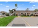 Neat condo with a grassy yard and parking spaces at 6250 7Th W Ave # 6250, Bradenton, FL 34209