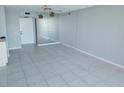 Bright living room features neutral walls and tile flooring, offering a clean, modern aesthetic at 6145 Sun Blvd # 607, St Petersburg, FL 33715